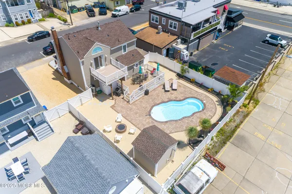an aerial view of a house with outdoor space