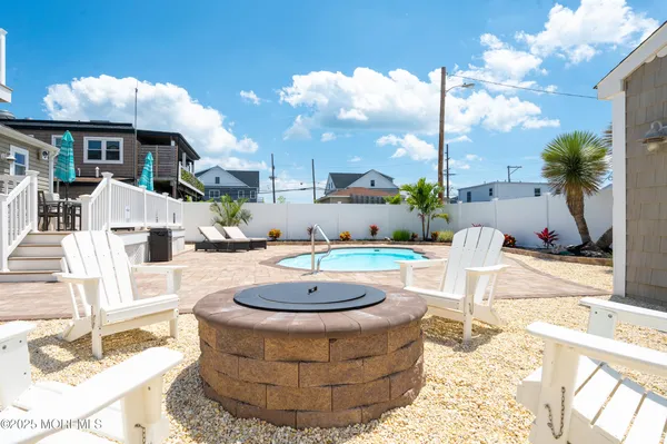 a view of a patio with couches table and chairs