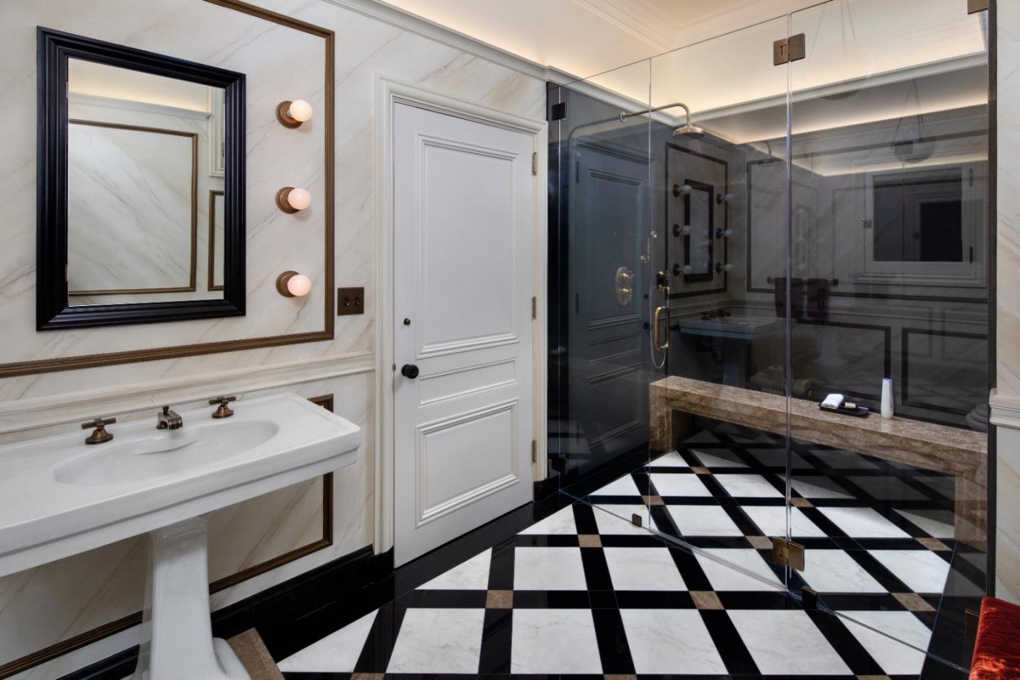 891 Crystal Springs Road Hillsborough, CA 94010 - Photo 12 of 20 a bathroom with a sink a toilet and mirror