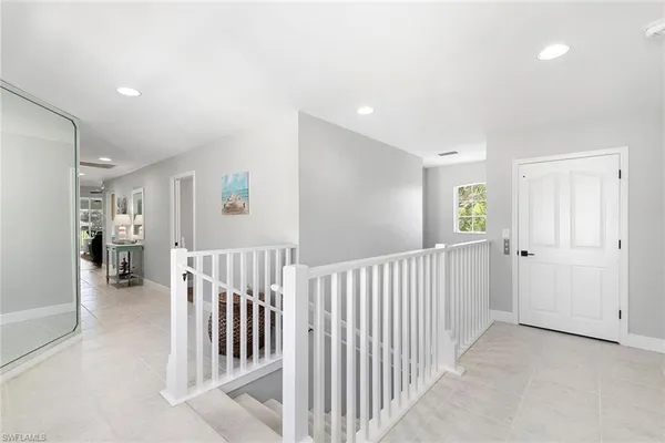 a dining room with a table and chairs