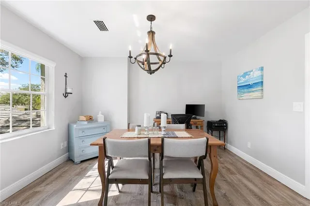 a view of a dining room with furniture window and outside view