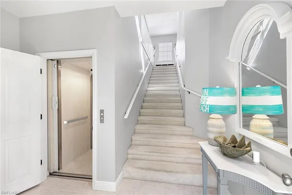 a bedroom with two beds and a window