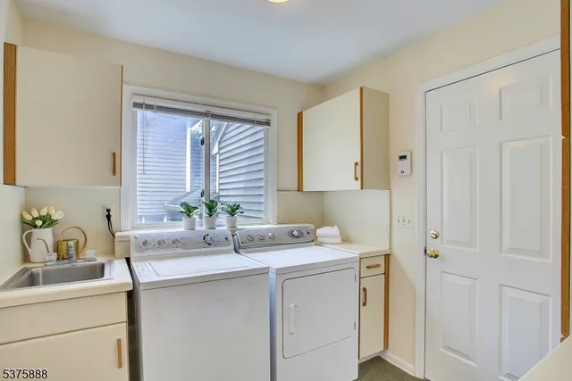 a view of a livingroom with furniture wooden floor and windows