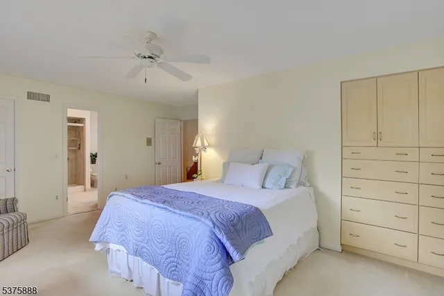 a bathroom with a sink double vanity mirror and a bathtub