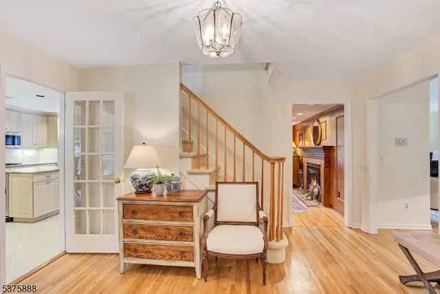 a bedroom with furniture and wooden floor