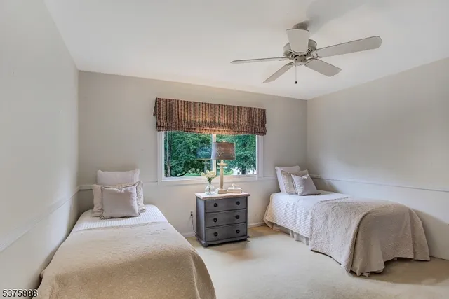 a bathroom with a sink toilet and a mirror