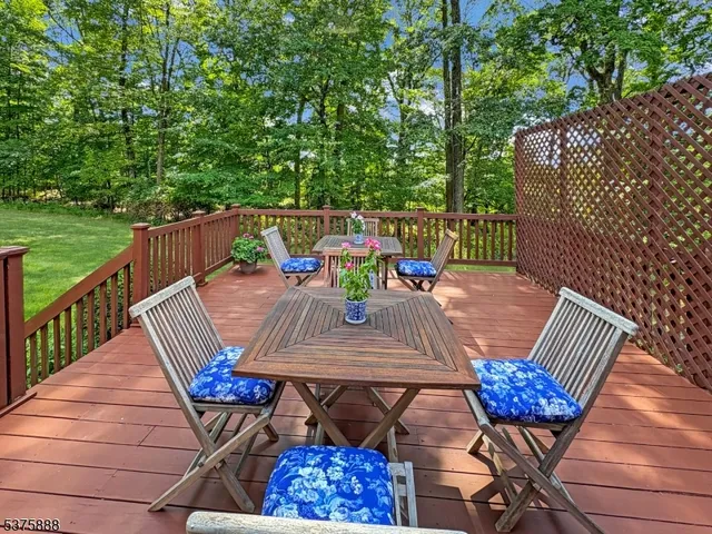 a view of a street with wooden fence