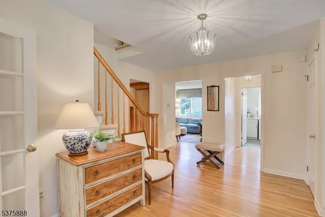 a living room with furniture a rug and a large window