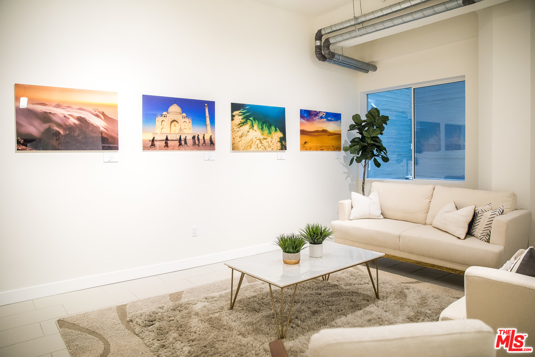 939 South Broadway, Unit M2 Los Angeles, CA 90015 - Photo 1 of 9 a living room with furniture and a potted plant