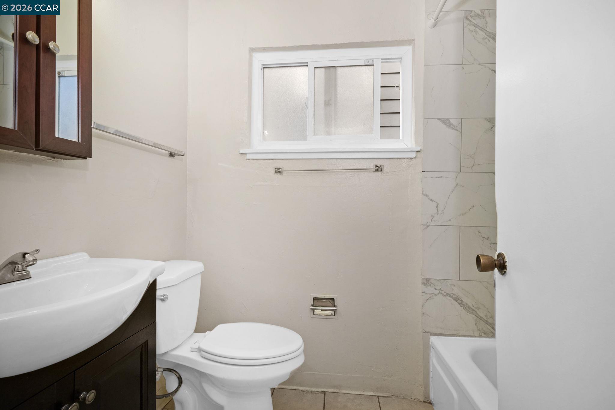 1926 Alcatraz Avenue, Unit 2 Berkeley, CA 94703 - Photo 13 of 13 a bathroom with a sink a toilet and shower