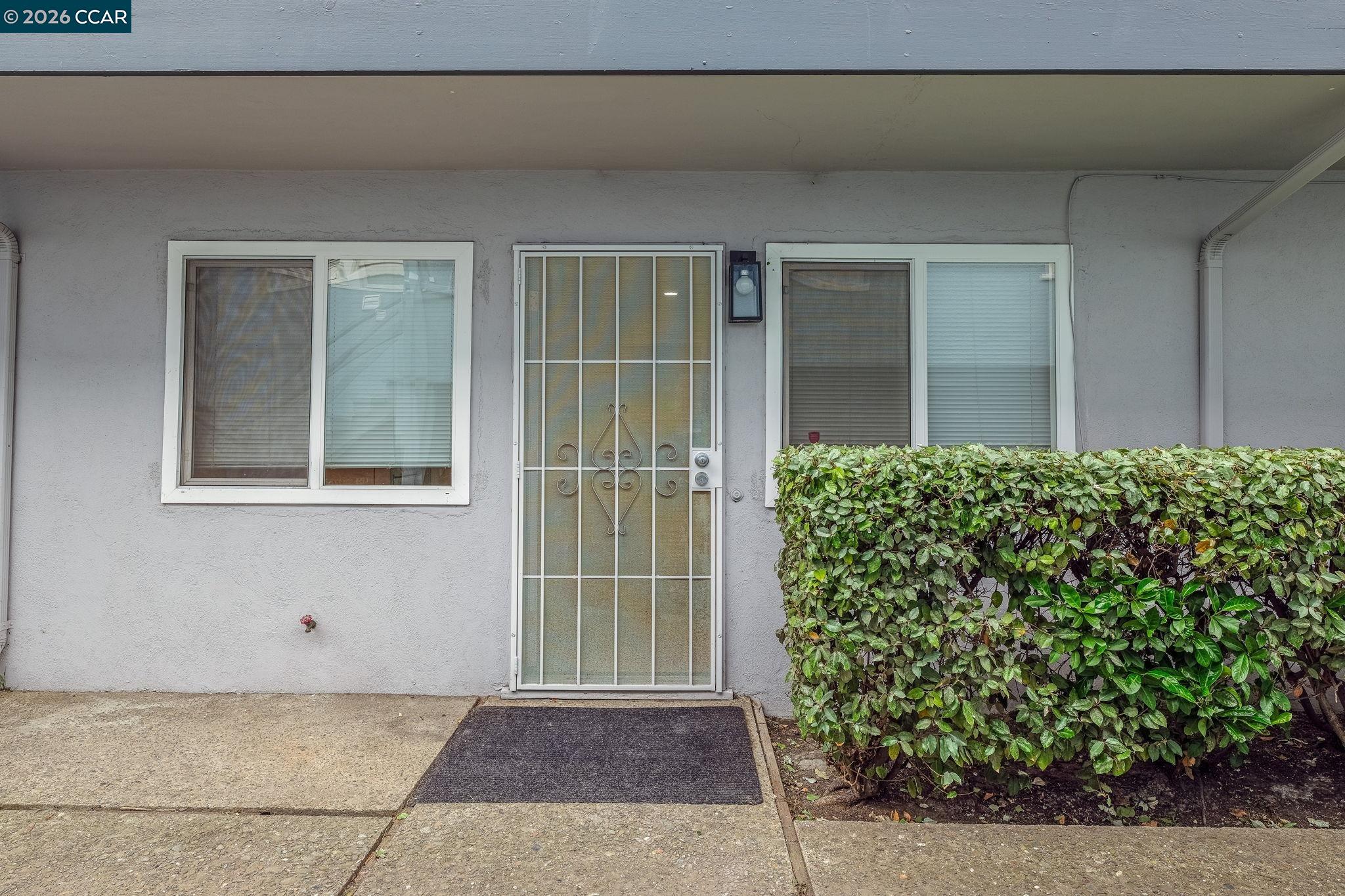 1926 Alcatraz Avenue, Unit 2 Berkeley, CA 94703 - Photo 4 of 13 a view of a house with a flower garden