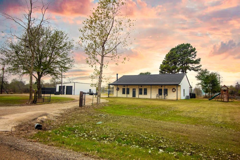 10800 Estate Lane Terrell, TX 75161 - Photo 1 of 30 a front view of a house with a yard