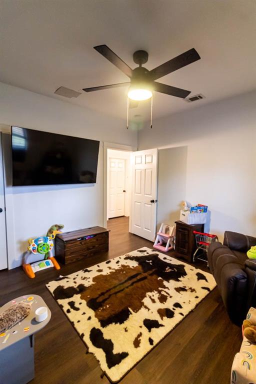 10800 Estate Lane Terrell, TX 75161 - Photo 21 of 30 a bedroom with a bed and a flat screen tv