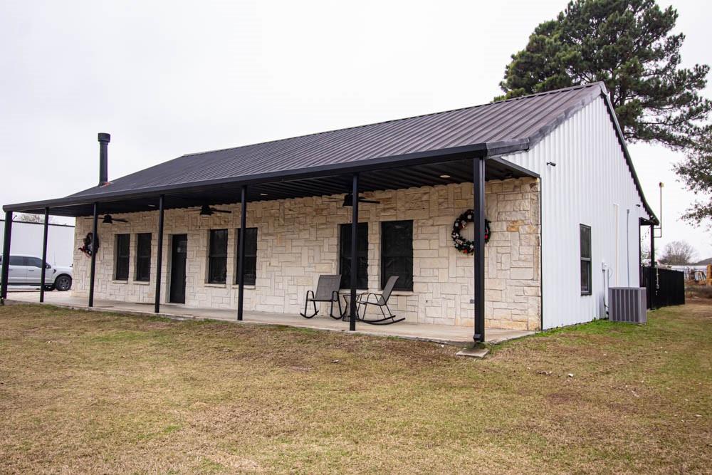 10800 Estate Lane Terrell, TX 75161 - Photo 4 of 30 a front view of a house with a garden
