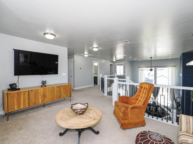 2487 Canyon Wild Road, Unit 413 Draper, UT 84020 - Photo 43 of 75 Living area featuring light colored carpets