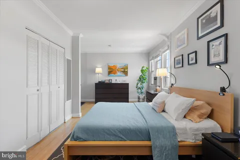 a bedroom with a bed and a couch