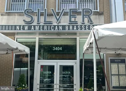 a front view of a building with glass windows and door