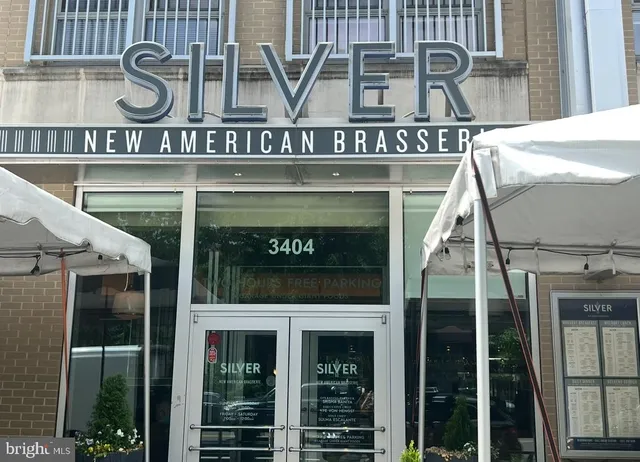 a front view of a building with glass windows and door