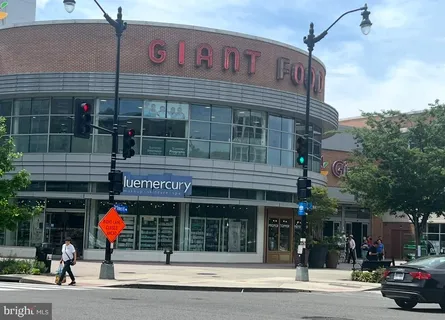a view of a building with a window and bench