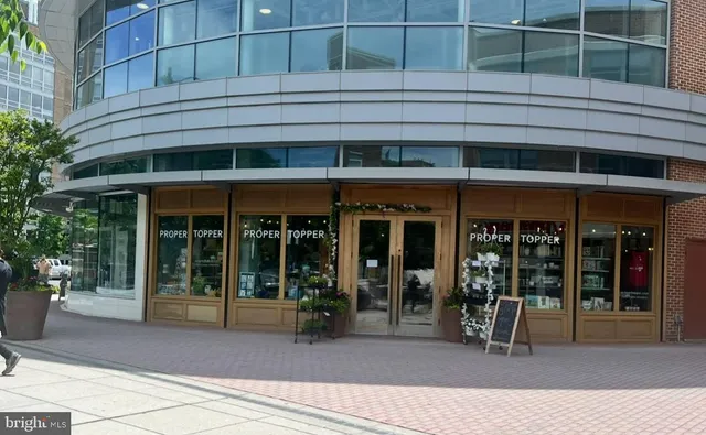 a view of a patio with table and chairs potted plants