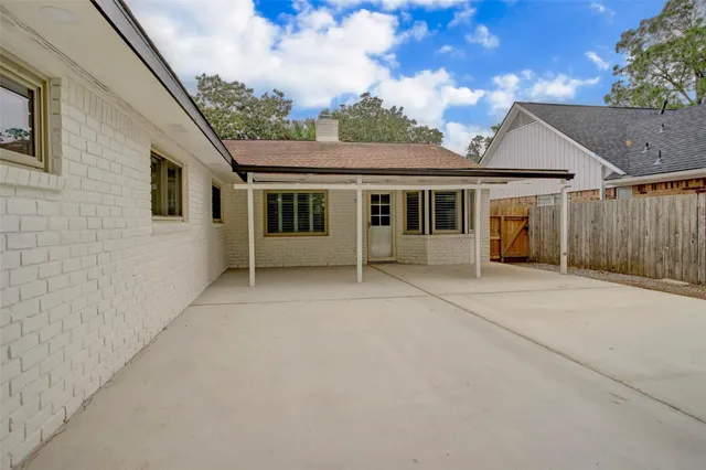 a front view of a house with a yard and porch