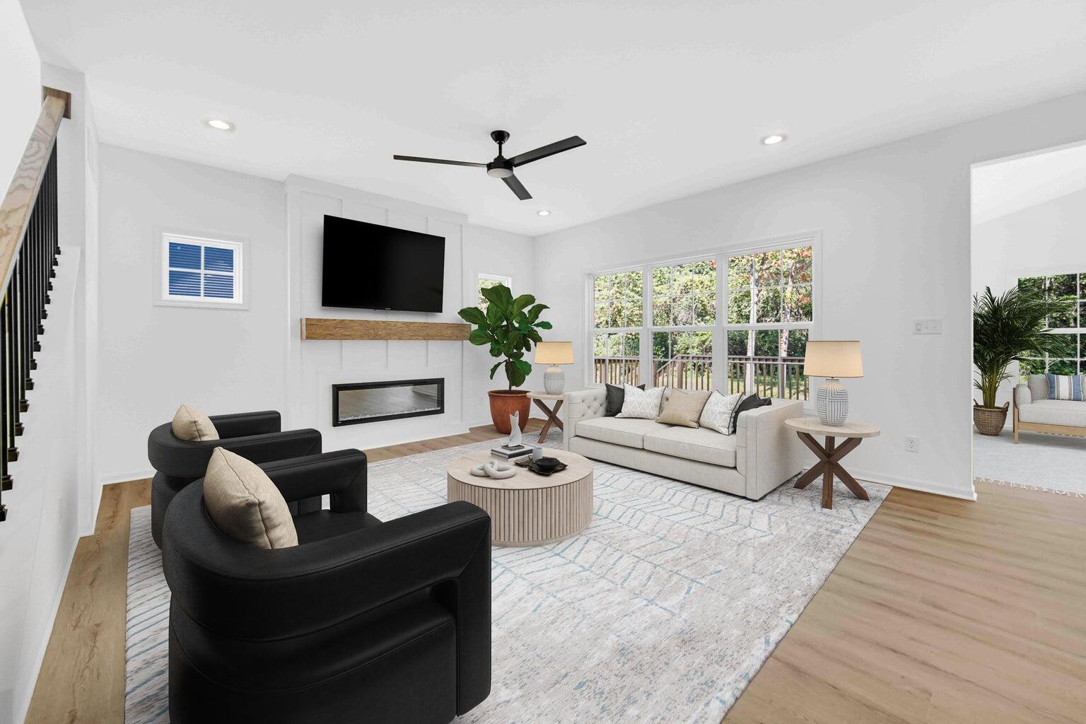 712 Verdano Terrace Crown Point, IN 46307 - Photo 2 of 24 a living room with fireplace furniture and a flat screen tv