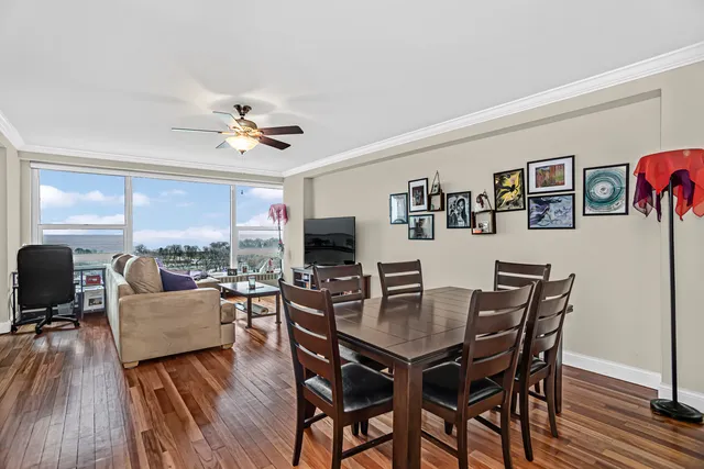 a view of a dining room with furniture window and wooden floor