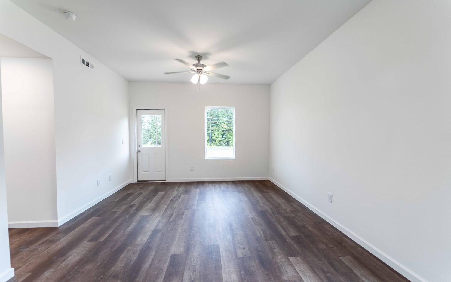 77 Stonehenge Lane Manchester, TN 37355 - Photo 11 of 16 wooden floor in an empty room with a window