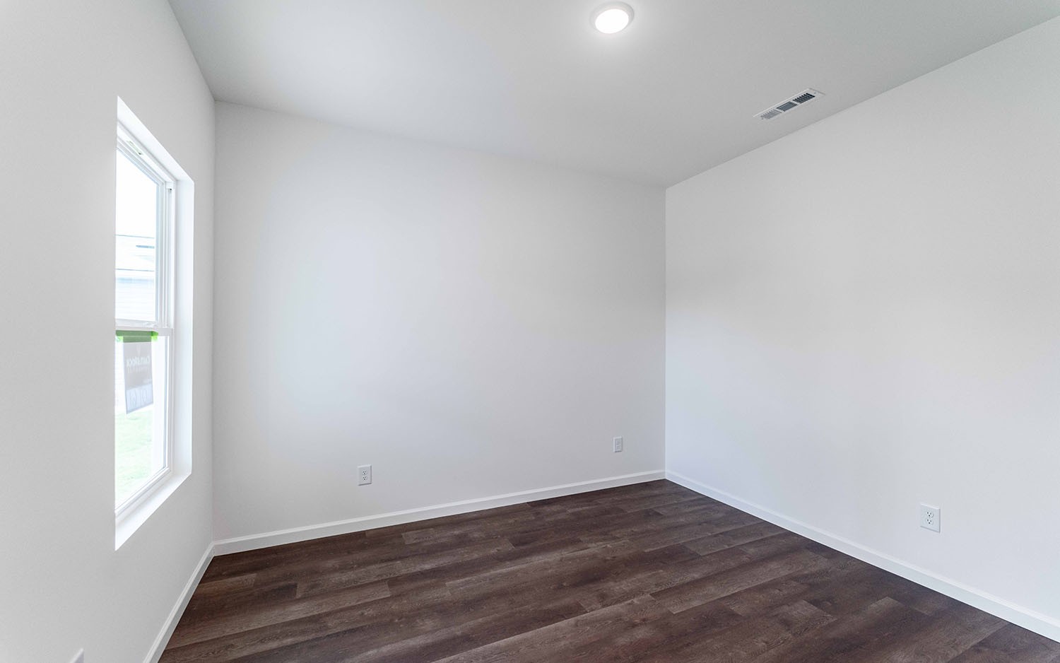 77 Stonehenge Lane Manchester, TN 37355 - Photo 16 of 16 a view of an empty room with wooden floor and a window