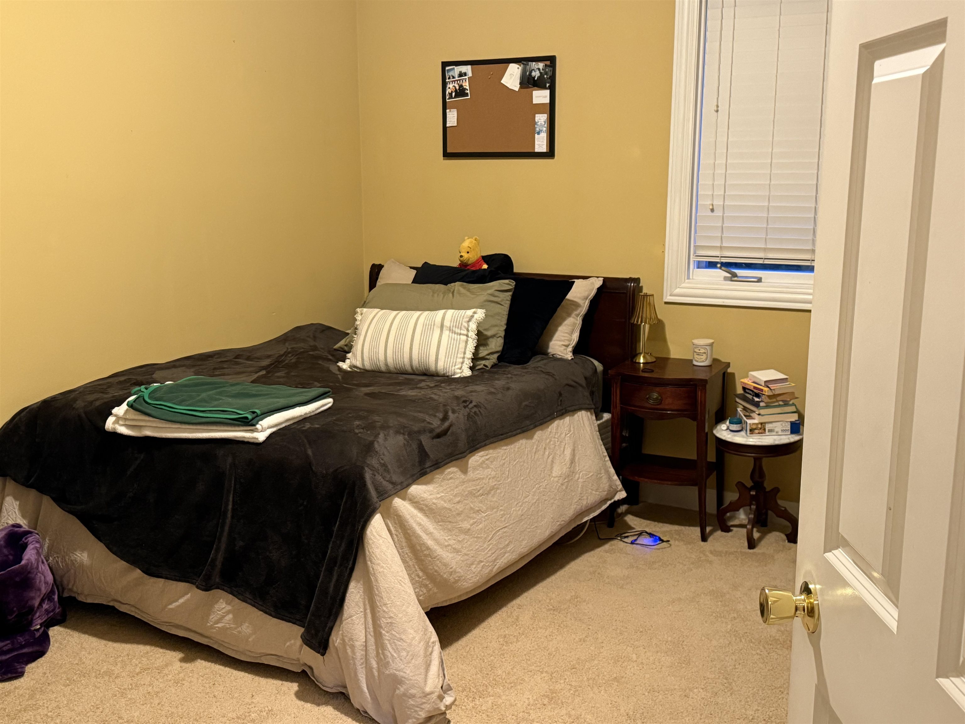 649 Roxbury Road Rockford, IL 61107 - Photo 16 of 19 a bed sitting in a bedroom next to a window with chair