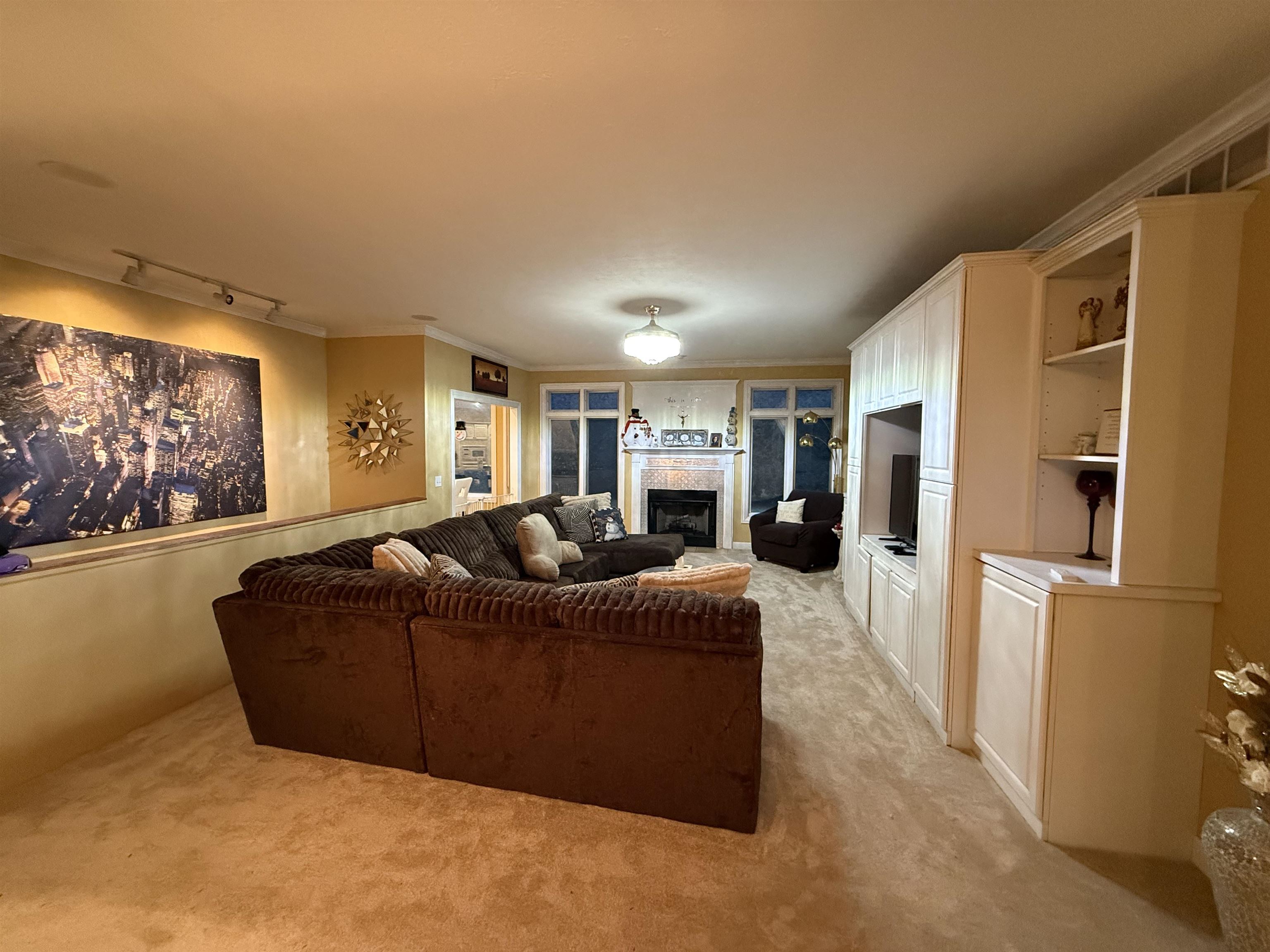 649 Roxbury Road Rockford, IL 61107 - Photo 9 of 19 a living room with furniture a large window and a flat screen tv