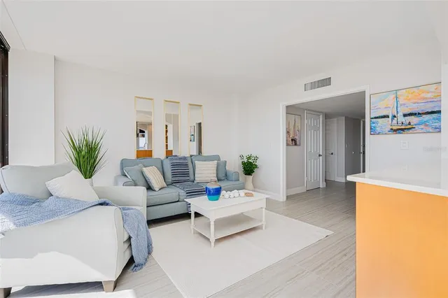 a living room with furniture and white walls