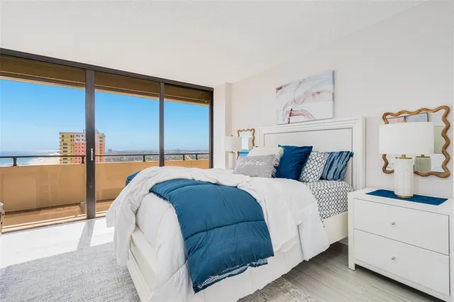 a bedroom with a bed and lamp