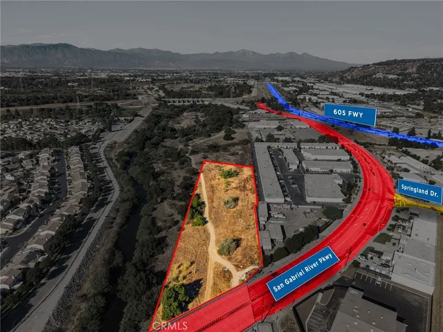a view of multiple houses with a road