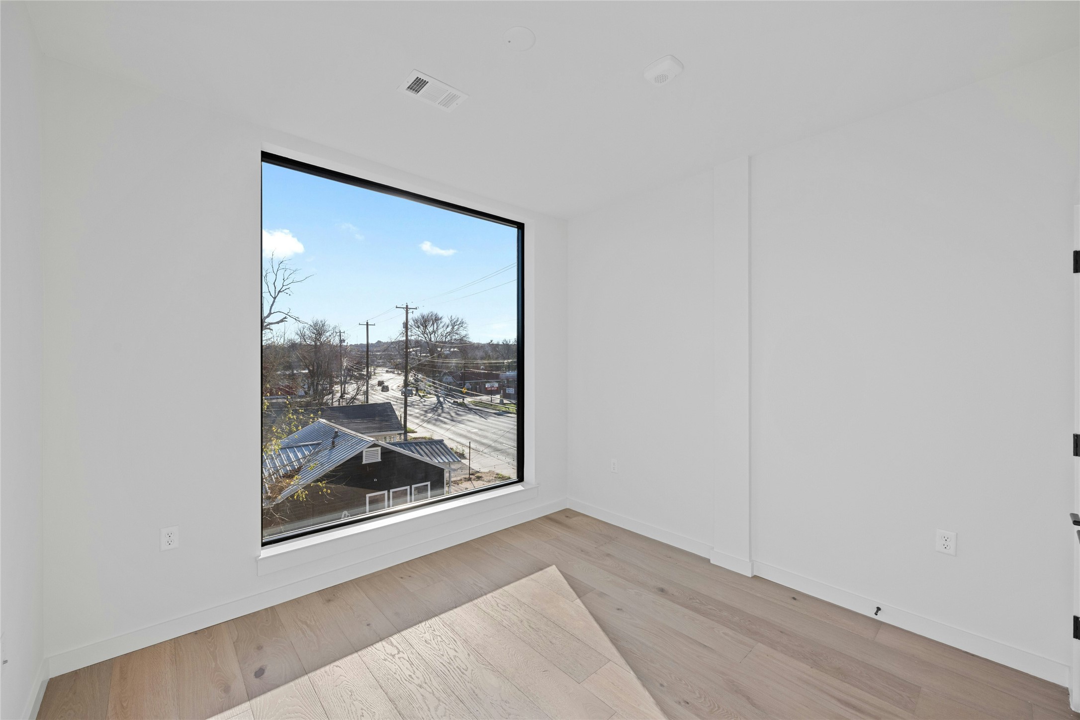 2209 South 1st Street, Unit 321 Austin, TX 78704 - Photo 21 of 40 a view of a hallway with a glass door and a window
