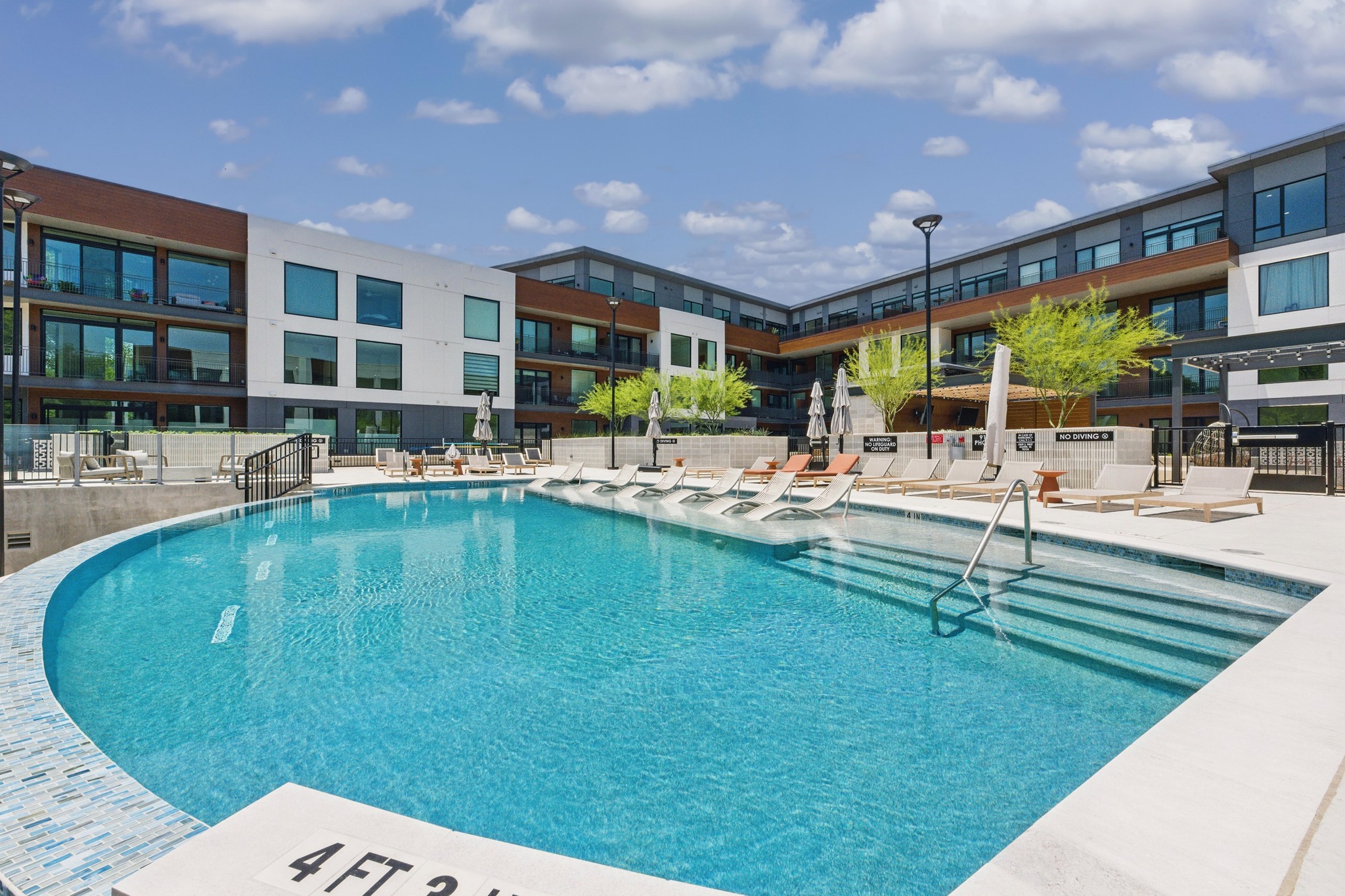 2209 South 1st Street, Unit 321 Austin, TX 78704 - Photo 37 of 40 a swimming pool with outdoor seating and yard