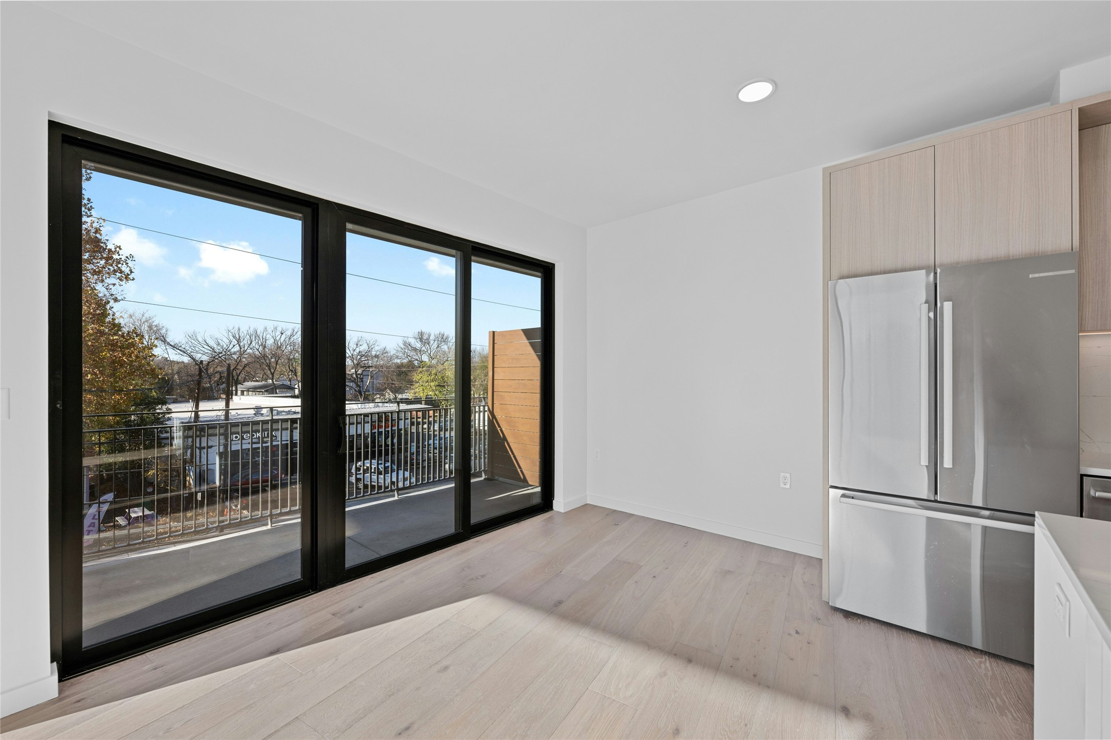 2209 South 1st Street, Unit 321 Austin, TX 78704 - Photo 7 of 40 a view of a big room with windows and refrigerator