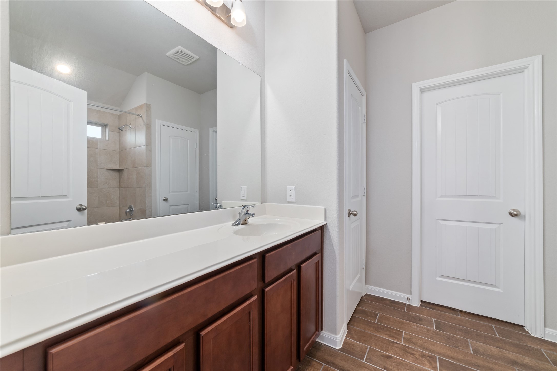 21622 Buttonsage Lane Katy, TX 77449 - Photo 13 of 17 a bathroom with a sink and a mirror