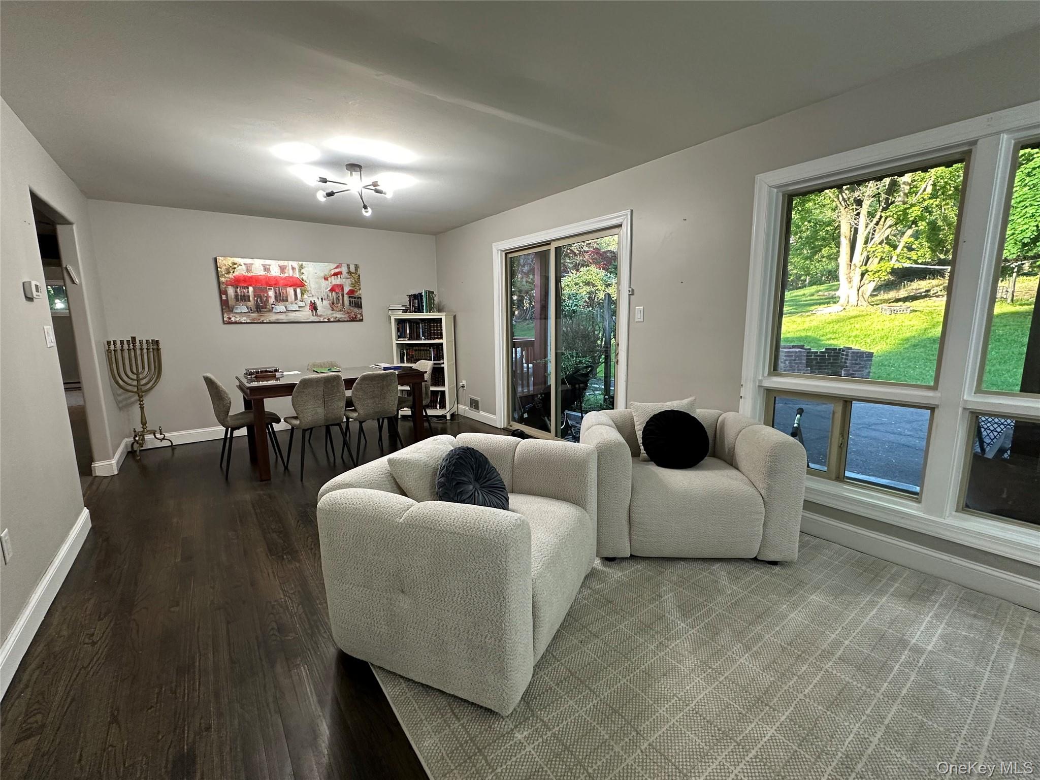 254 Hempstead Road Spring Valley, NY 10977 - Photo 2 of 7 a living room with furniture and a flat screen tv