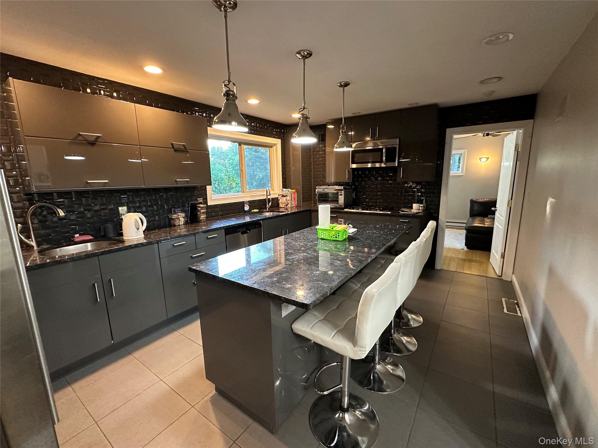 254 Hempstead Road Spring Valley, NY 10977 - Photo 3 of 7 a kitchen with a table and chairs in it