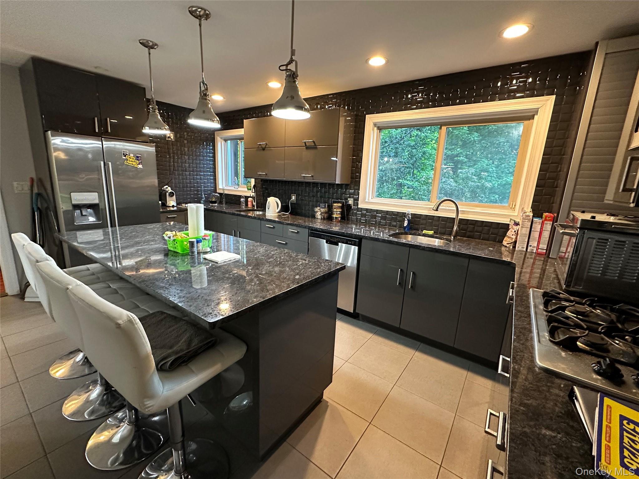 254 Hempstead Road Spring Valley, NY 10977 - Photo 4 of 7 a kitchen with granite countertop sink stove and refrigerator