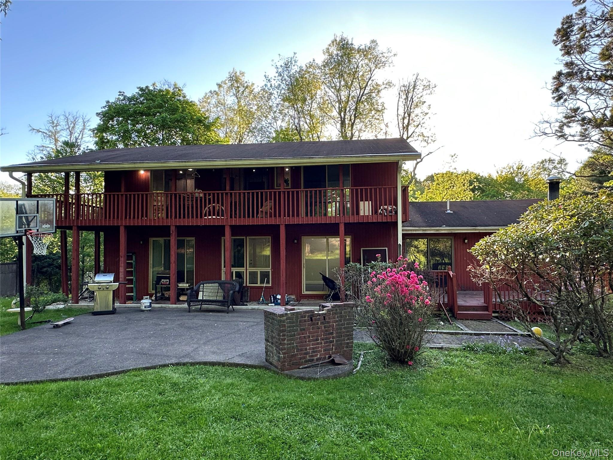 254 Hempstead Road Spring Valley, NY 10977 - Photo 6 of 7 a front view of a building with garden and trees