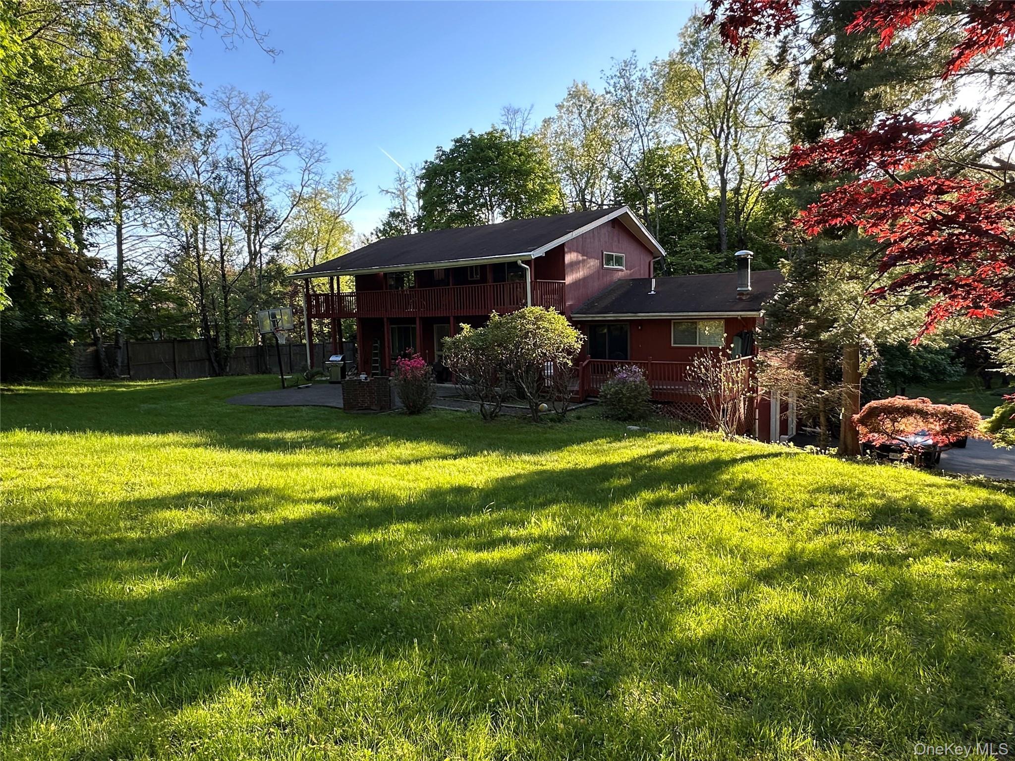 254 Hempstead Road Spring Valley, NY 10977 - Photo 7 of 7 a view of a house with a big yard and large trees