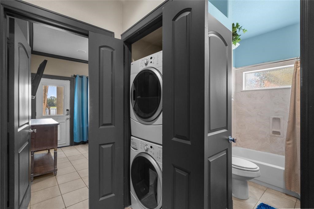 607 28th Street San Leon, TX 77539 - Photo 12 of 44 a view of a hallway with washer and dryer