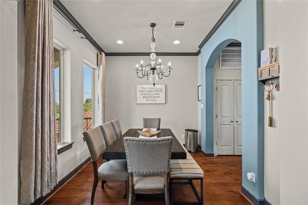 607 28th Street San Leon, TX 77539 - Photo 14 of 44 a view of a dining room with furniture window and wooden floor