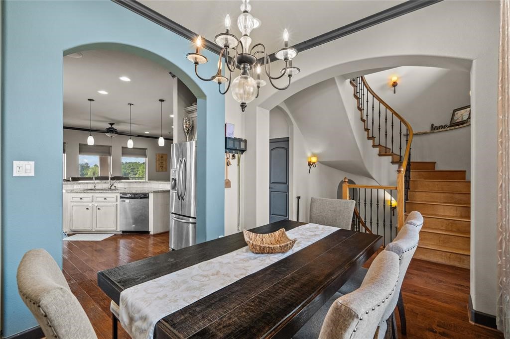 607 28th Street San Leon, TX 77539 - Photo 15 of 44 a view of a dining room with furniture and a chandelier