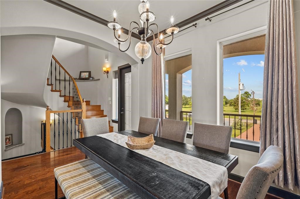 607 28th Street San Leon, TX 77539 - Photo 16 of 44 a living room with furniture and a chandelier