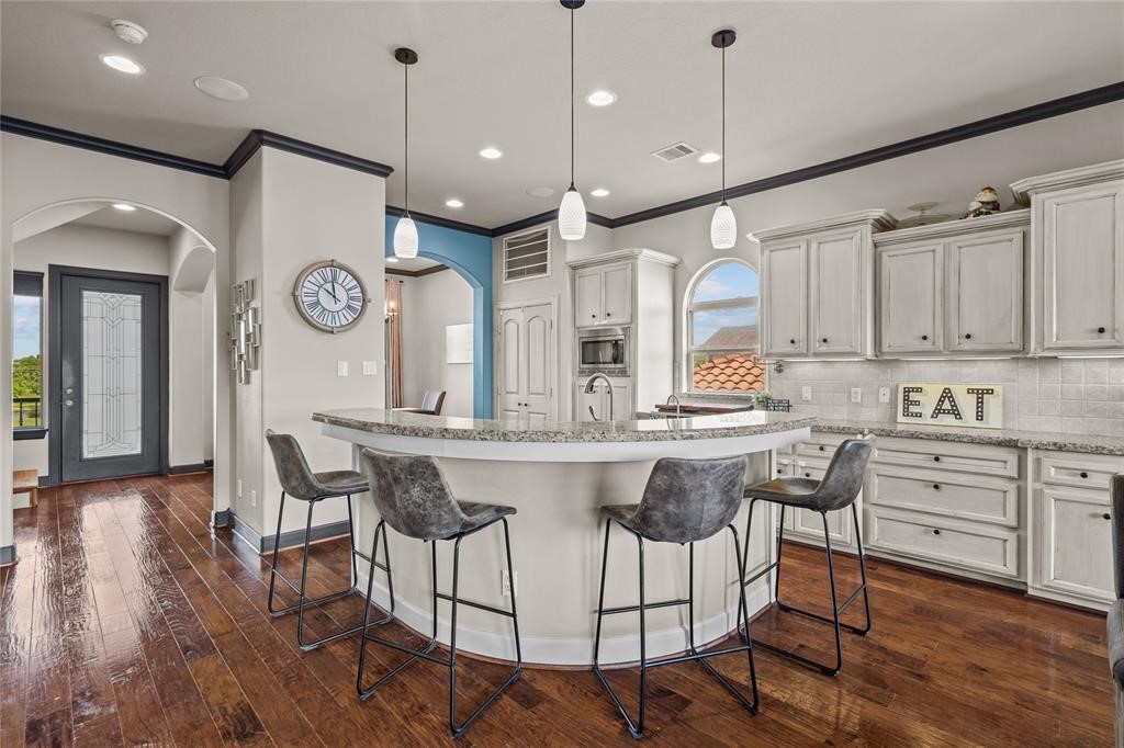 607 28th Street San Leon, TX 77539 - Photo 24 of 44 a kitchen with a sink cabinets and wooden floor