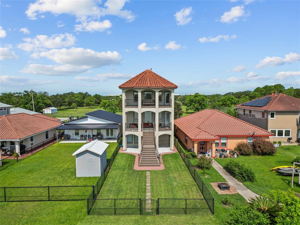 607 28th Street San Leon, TX 77539 - Photo 3 of 44 an aerial view of a house with yard porch and furniture