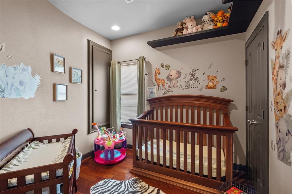 607 28th Street San Leon, TX 77539 - Photo 35 of 44 a bedroom with furniture and wooden floor
